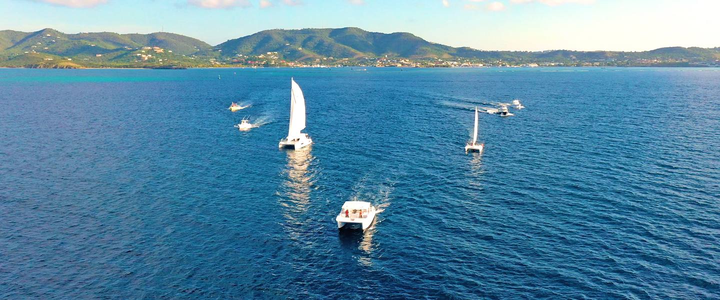 Caribbean Sea Adventures boats on turquoise water off St. Croix, seen from above