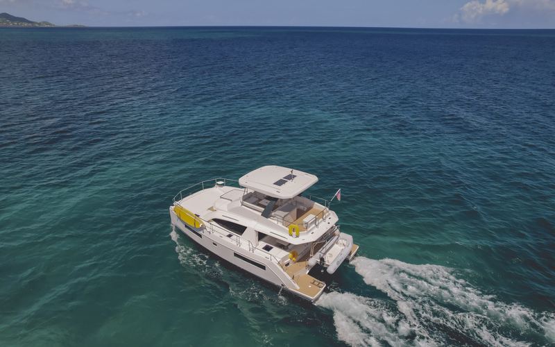 Good Times power catamaran cruising over turquoise water off St. Croix