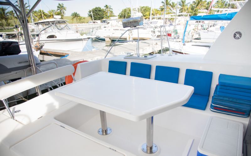 Shaded deck and lounge seating aboard the Inconceivable catamaran