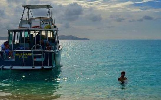 Mile Mark at Buck Island with a snorkeler in the water
