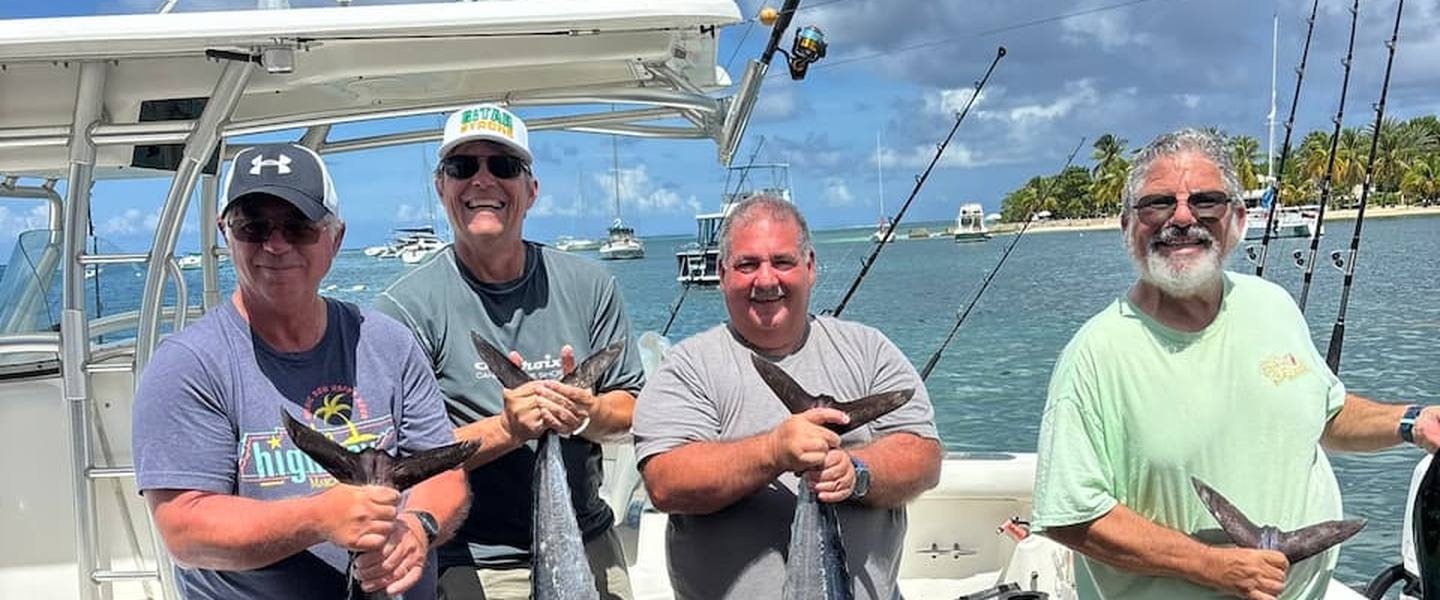 Day Break Charters guests with wahoo and mahi on the dock at Green Cay Marina, St. Croix