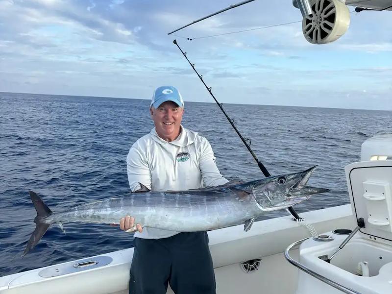 A fishing crew with a big wahoo on the back deck of a St. Croix fishing boat