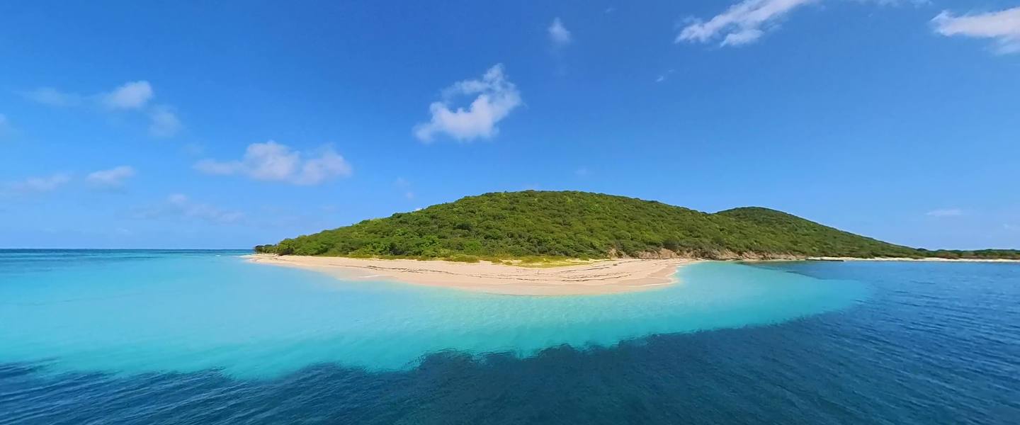 Buck Island and its white-sand beach rising from turquoise water off St. Croix