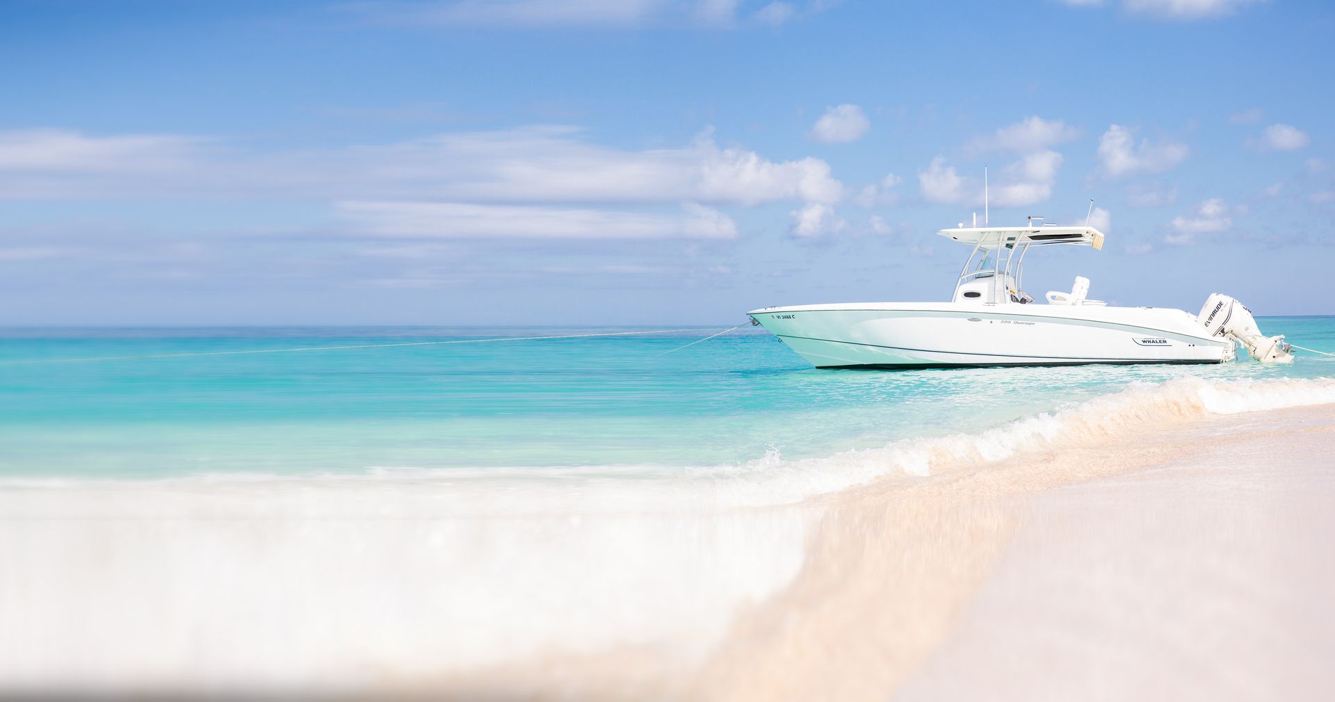 Smooth Recovery, our 32 ft Boston Whaler, anchored off a white sand beach on St. Croix