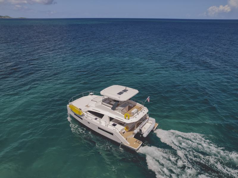 The Good Times power catamaran under way over deep blue water off St. Croix