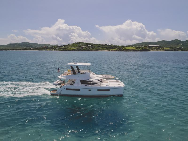 Aerial view of the Good Times power catamaran on calm water off St. Croix