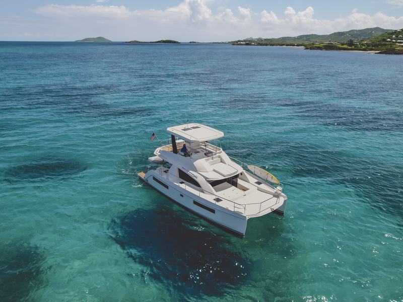 Good Times power catamaran cruising over turquoise water near Buck Island