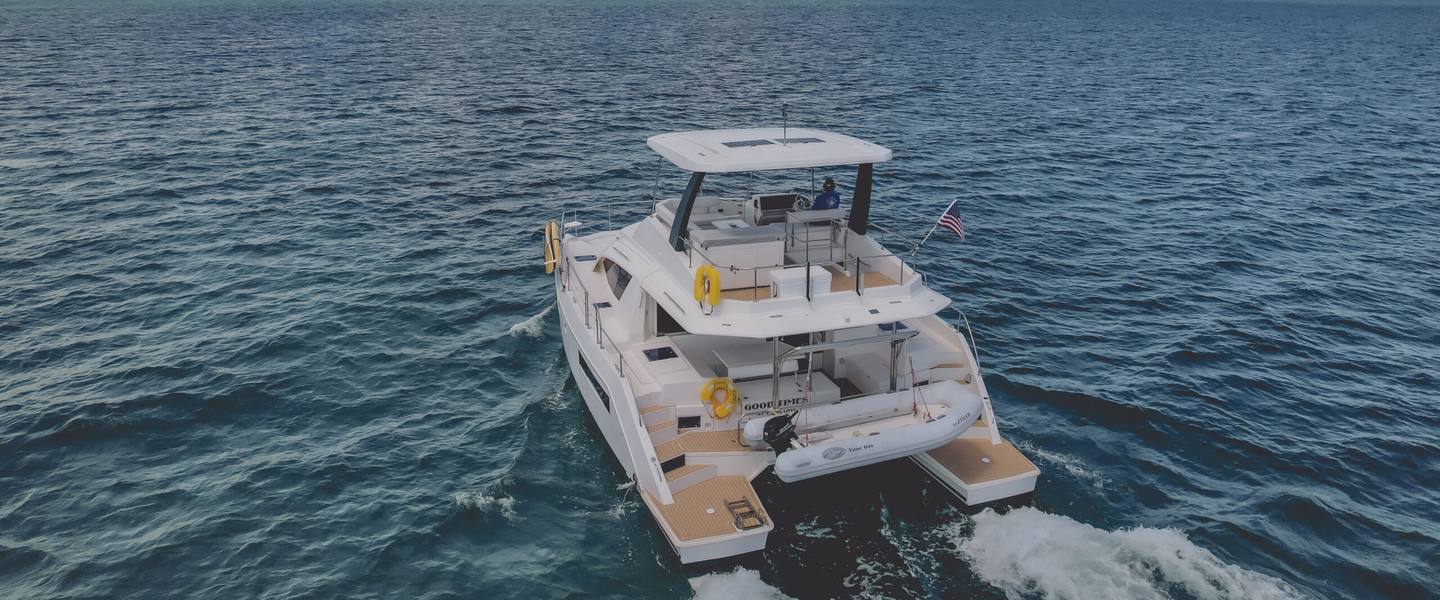 Good Times power catamaran under way with its wake behind, off St. Croix