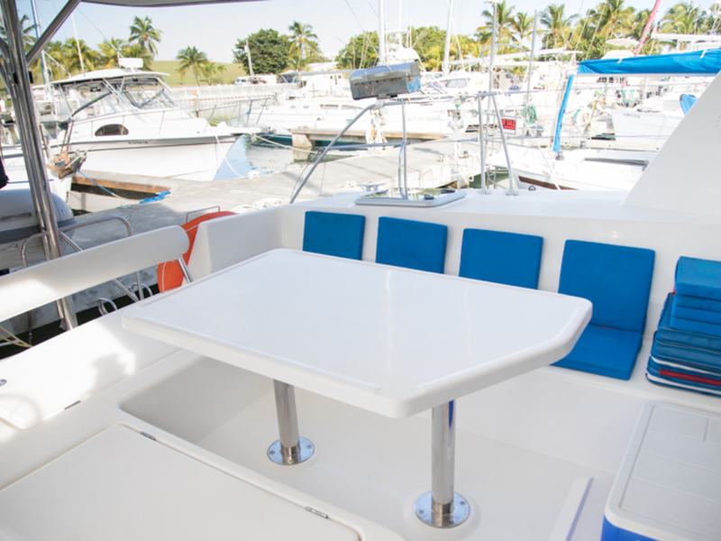 The shaded cockpit table and seating aboard the Inconceivable catamaran