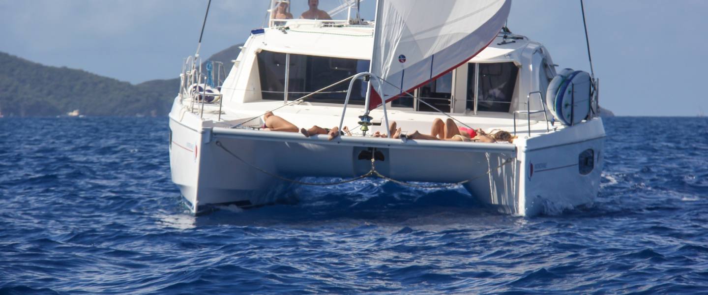 The Inconceivable sailing catamaran under sail on a private charter