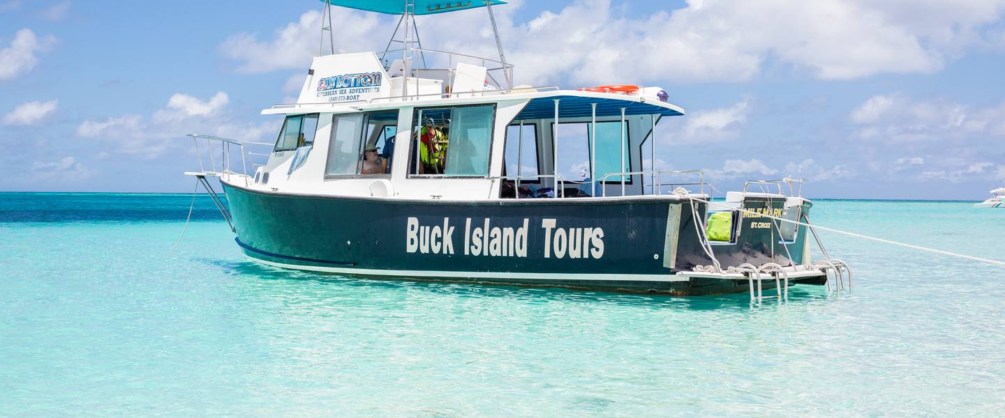 Mile Mark anchored in turquoise shallows off Buck Island