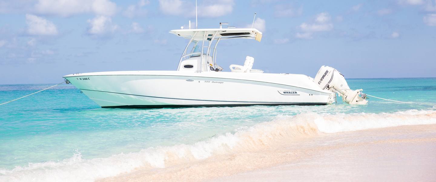 Smooth Recovery center console anchored off a white-sand beach on a private Buck Island charter