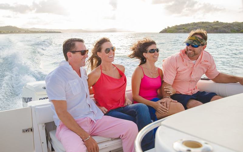 Guests relaxing aboard Smooth Recovery on a private sunset cruise